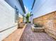 Long and narrow brick patio with outdoor kitchen and wooden wall at 8851 Sperry St, Orlando, FL 32827