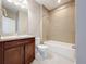 Clean bathroom with tub, toilet and vanity at 8851 Sperry St, Orlando, FL 32827