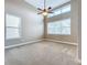 Spacious bedroom with high ceilings and two windows at 8851 Sperry St, Orlando, FL 32827