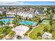 Community pool and volleyball court with palm trees at 8851 Sperry St, Orlando, FL 32827
