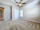 Spacious bedroom with high ceilings and ceiling fan at 8851 Sperry St, Orlando, FL 32827