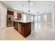 Open concept kitchen with island and stainless steel appliances at 8851 Sperry St, Orlando, FL 32827