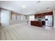 Open concept kitchen with island and stainless steel appliances at 8851 Sperry St, Orlando, FL 32827