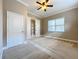 Bright bedroom with carpeted floors and ceiling fan at 8851 Sperry St, Orlando, FL 32827