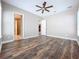 Bright bedroom with wood-look floors and ensuite bathroom at 8851 Sperry St, Orlando, FL 32827