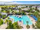 Community lap pool and leisure pool with lounge chairs at 8851 Sperry St, Orlando, FL 32827