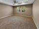 Spacious main bedroom with neutral wall colors and carpet flooring at 3402 Sagebrush St, Harmony, FL 34773