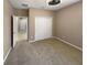 Guest bedroom with neutral carpeting and double door closet at 3402 Sagebrush St, Harmony, FL 34773