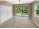Dining area with tile flooring and sliding glass doors leading to the patio at 3402 Sagebrush St, Harmony, FL 34773