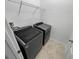 Laundry room with washer, dryer, and shelving at 3402 Sagebrush St, Harmony, FL 34773