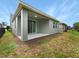 Covered patio and fenced backyard at 3402 Sagebrush St, Harmony, FL 34773