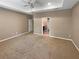 Large main bedroom with plush carpeting and an ensuite bathroom at 3402 Sagebrush St, Harmony, FL 34773