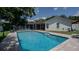 Inviting swimming pool with brick paver deck, surrounded by lush landscaping at 1281 Eastland Pt, Longwood, FL 32750