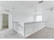 Upstairs hall with carpet flooring and a view of a bathroom at 811 Balmoral Dr, Davenport, FL 33896