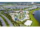 Community pool and surrounding homes at 4721 Clock Tower Dr # 108, Kissimmee, FL 34746