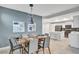 Modern dining room with an open concept kitchen at 4721 Clock Tower Dr # 108, Kissimmee, FL 34746