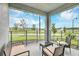 Spacious balcony with water views and comfortable seating at 4721 Clock Tower Dr # 108, Kissimmee, FL 34746