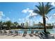 Large resort-style pool with lounge chairs at 4721 Clock Tower Dr # 108, Kissimmee, FL 34746