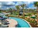 Community lazy river and resort-style pool with landscaping at 4721 Clock Tower Dr # 108, Kissimmee, FL 34746