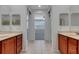 Large bathroom with double sinks and access to bedroom at 2286 Chatham Place Dr, Orlando, FL 32824