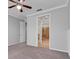 Main bedroom with en-suite bathroom access and ceiling fan at 2286 Chatham Place Dr, Orlando, FL 32824