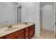 Double vanity bathroom with wood cabinets and a shower/tub combo at 2286 Chatham Place Dr, Orlando, FL 32824