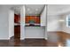 Open kitchen with hardwood floors and island at 2286 Chatham Place Dr, Orlando, FL 32824