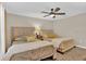 Bright bedroom featuring two twin beds and ceiling fan at 11918 Sonnet Ave, Orlando, FL 32832