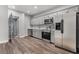 Modern kitchen with stainless steel appliances and gray cabinets at 701 N Grandview Ave, Daytona Beach, FL 32118