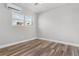 Bedroom with hardwood floors and a window providing natural light at 701 N Grandview Ave, Daytona Beach, FL 32118