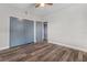 Bedroom with wood-look floors, sliding doors, and additional door at 701 N Grandview Ave, Daytona Beach, FL 32118