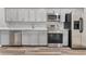 Modern kitchen with gray cabinets and stainless steel appliances at 701 N Grandview Ave, Daytona Beach, FL 32118