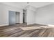 Bright bedroom featuring wood-look floors and a sliding door closet at 701 N Grandview Ave, Daytona Beach, FL 32118