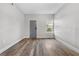 Living room with wood-look floors and a window at 701 N Grandview Ave, Daytona Beach, FL 32118
