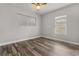 Spacious bedroom with wood-look floors and large window at 701 N Grandview Ave, Daytona Beach, FL 32118