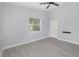 Bright bedroom with ceiling fan, tile floors, and ample closet space at 2524 Dellwood Dr, Orlando, FL 32806