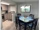 Cozy dining area with a four-person table and kitchen views at 1404 N Atlantic Ave # 4, Daytona Beach, FL 32118