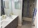 Updated bathroom with double vanity and tub shower at 1404 N Atlantic Ave # 4, Daytona Beach, FL 32118