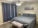 Bright bedroom with a king-size bed and updated flooring at 1404 N Atlantic Ave # 4, Daytona Beach, FL 32118