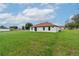 View of the back of the house and spacious yard at 11 Spruce Pass, Ocala, FL 34472