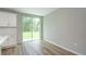 Kitchen with white cabinets and sliding glass door at 11 Spruce Pass, Ocala, FL 34472