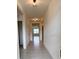 Bright and spacious entryway with tile flooring and neutral color palette at 5589 Winona Dr, Saint Cloud, FL 34771