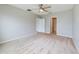 Spacious bedroom with carpeted floor and ceiling fan at 1502 Jadewood Way, Kissimmee, FL 34744
