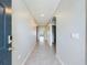 Bright and spacious foyer with neutral tile flooring and arched doorways at 1502 Jadewood Way, Kissimmee, FL 34744
