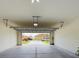 Garage with open door, showing view of community at 1502 Jadewood Way, Kissimmee, FL 34744