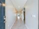 Neutral-toned entryway with tile floors and archways leading to other rooms at 1502 Jadewood Way, Kissimmee, FL 34744
