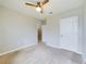 Spacious bedroom with neutral walls and carpet flooring at 1502 Jadewood Way, Kissimmee, FL 34744