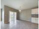Dining room with tile floors and sliding glass doors to patio at 1502 Jadewood Way, Kissimmee, FL 34744