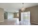 Dining area with chandelier and access to other rooms at 1502 Jadewood Way, Kissimmee, FL 34744