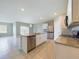 Open concept kitchen with island and stainless steel appliances at 1502 Jadewood Way, Kissimmee, FL 34744